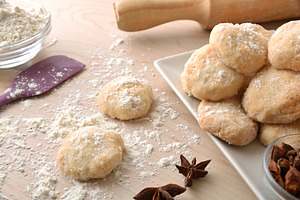 Detail of freshly made anise cookies on wooden bench, a Food & Drink Photo by Davizro's Market