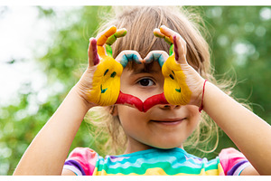 Children's hands with smile paints, an Arts & Entertainment Photo by yanadjana