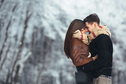 Happy couple in snow park stock photo containing amazing and snow