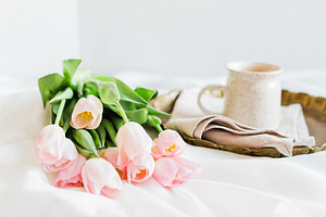 Pink Tulips on Bed with Coffee 