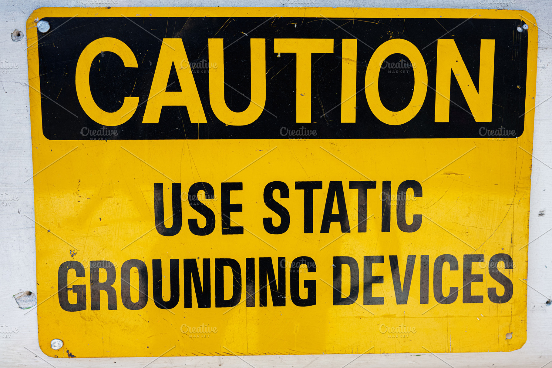 Caution sign indicating requirement for static grounding devices in workplace, a Photo by AS photostudio