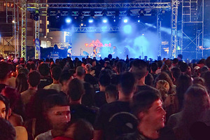 Crowd at night concert with colorful stage lighting, an Arts & Entertainment Photo by DanFLCreativo