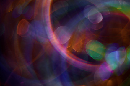 Fluorescent circle defocused glittery lens flare, a Background Photo by Photo Drive Studio