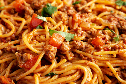 Homemade One-Pot Taco Spaghetti on a Plate, side view., a Food & Drink Photo by LiudmylaChuhunova