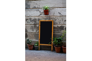 Blank chalkboard sandwich board with, a Background Photo by volodymyrshtun13795