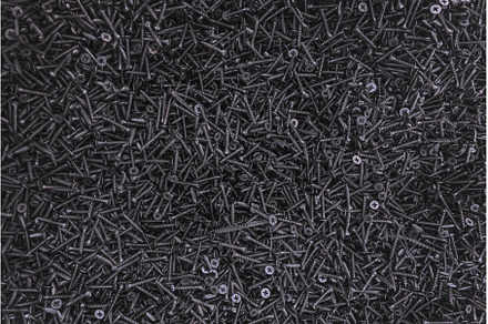 Lots of self-tapping screws close up, an Industrial Photo by yanadjana