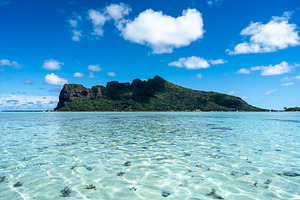 View of Maupiti Island from a white sand beach, French Polynesia, a Nature Photo by GoodGoods