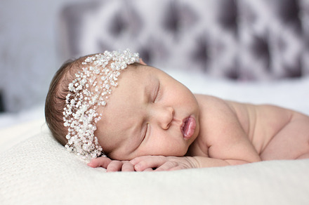 Newborn sleeping on stomach featuring innocence, happy, and child, a Person Photo by Natalia Lebedinskaia