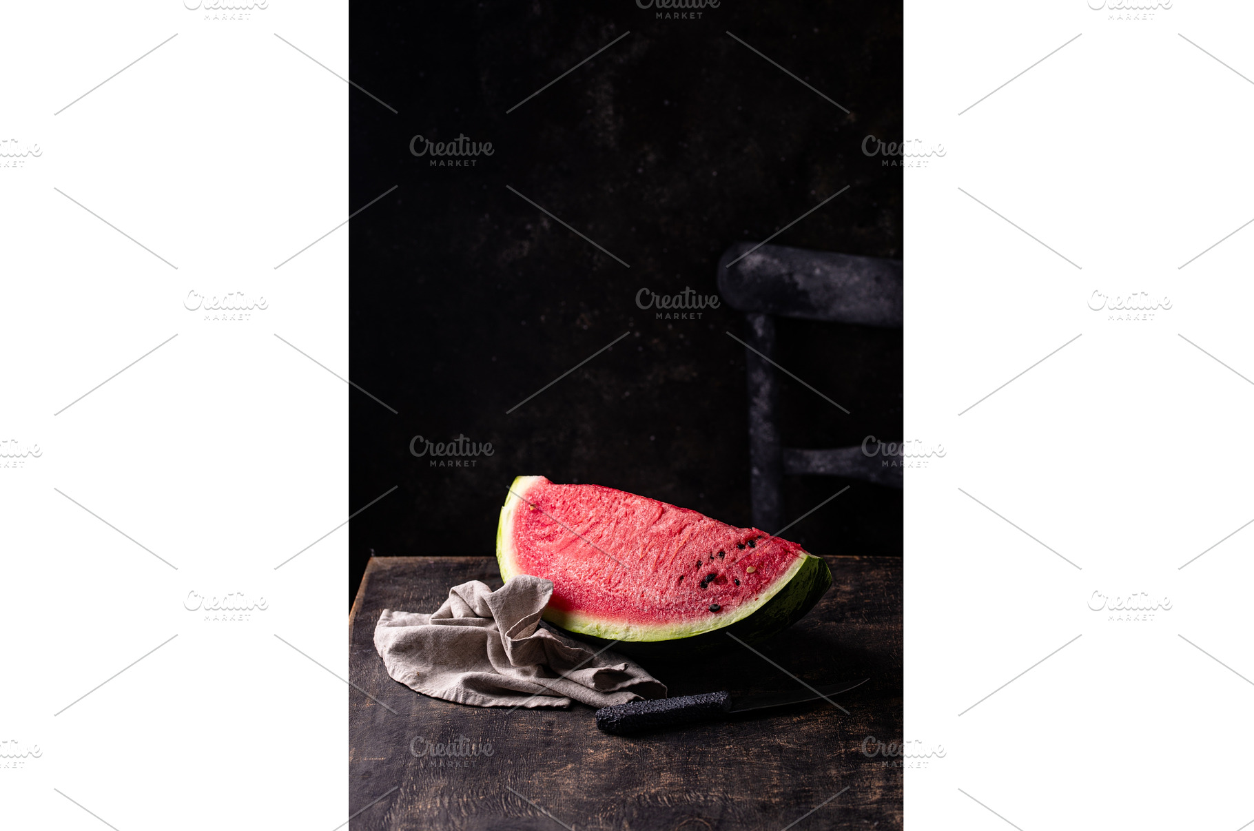 Sliced watermelon on black wooden, a Food & Drink Photo by Yulia Furman
