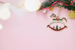 Happy New Year 2026 ! Horse christmas toy on pink flat lay with, a Holiday Photo by Sonjachni