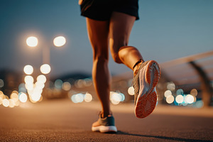 Runner in motion on a city street at night, a Sports & Recreation Photo by AlyaAnd