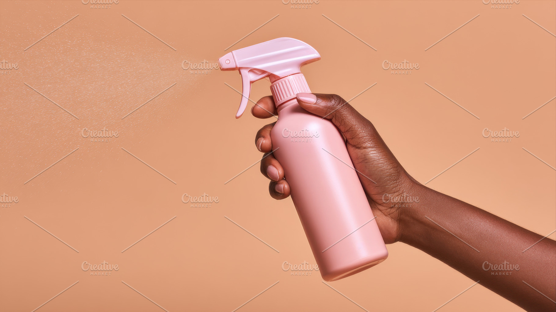 Hand with spray bottle, a Photo by Beautiful things