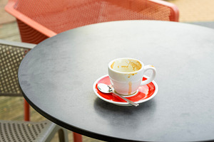 Empty coffee cup on a cafe table, a Food & Drink Photo by BOOCYS