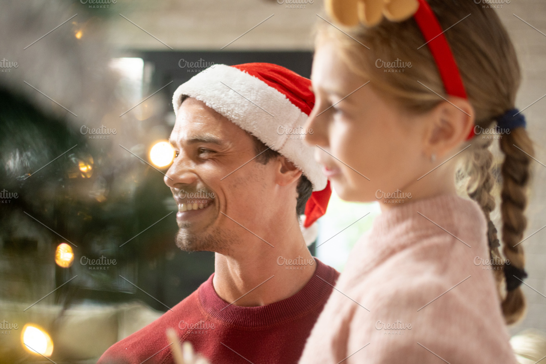Father and daughter enjoying Christmas together, a Person Photo by etorres69