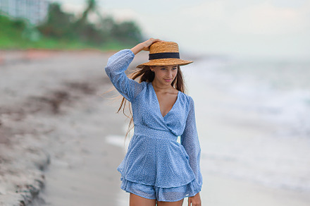 Beautiful teenager girl on tropical seashore at sunset. Beautiful little girl i, a Person Photo by travnikovstudio