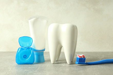 Concept of dental care or tooth care on gray textured table, a Health & Medical Photo by AtlasStudio PRO