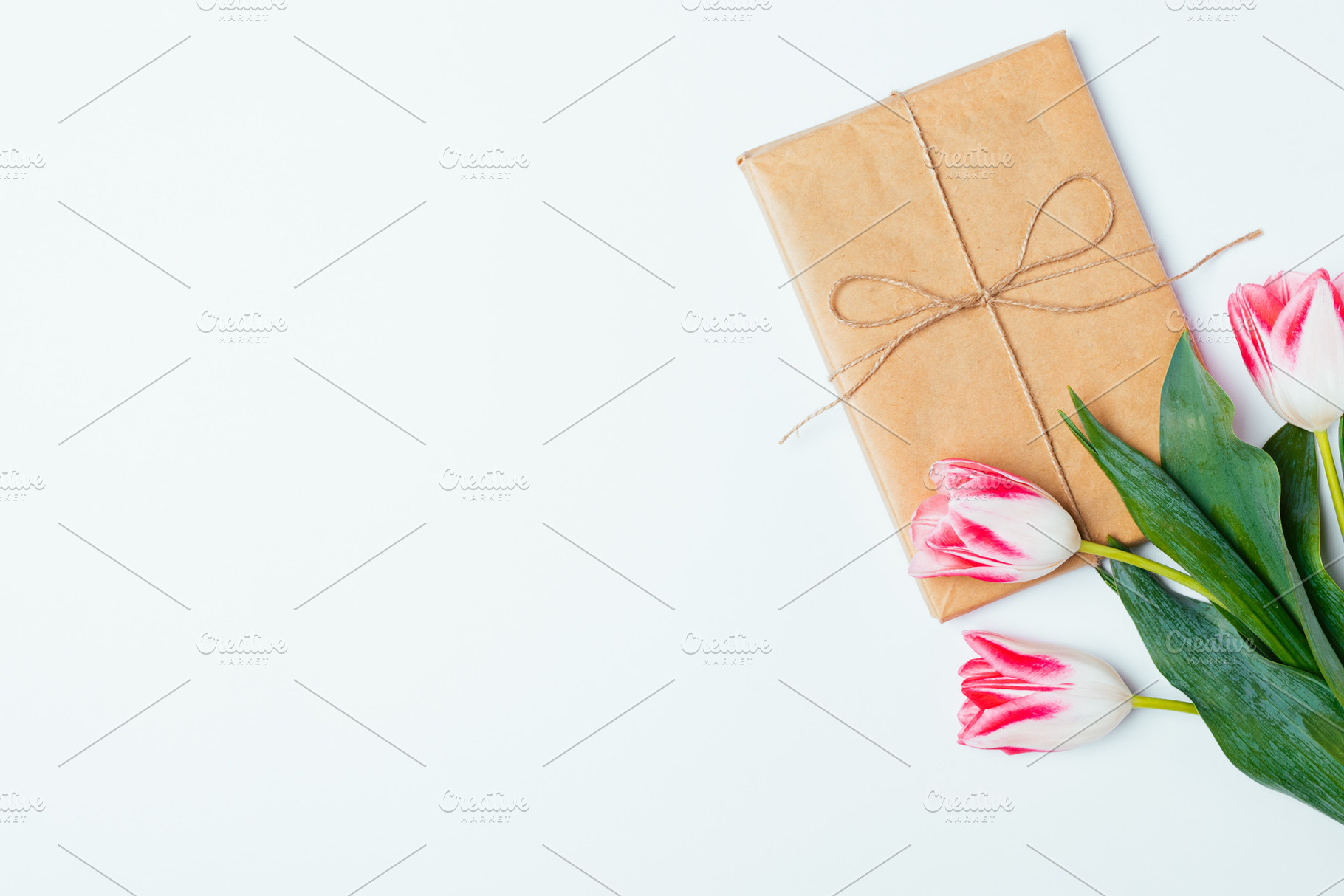 Flat lay composition of bouquet of tulips and gift box, a Holiday Photo by progressman