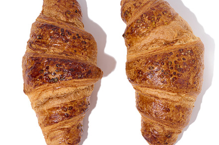 Baked croissant on a white isolated background, top view, a Food & Drink Photo by ndanko