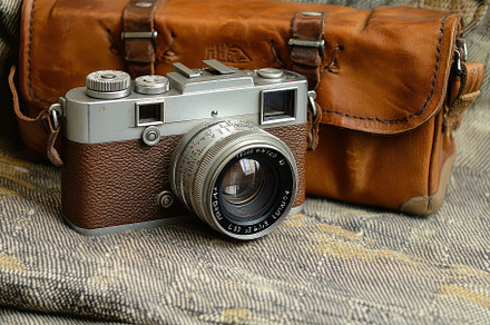Vintage camera with leather case pla, a Photo by Tanuart