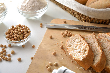 Sliced soy bread on cutting board on kitchen bench, a Food & Drink Photo by Davizro's Market
