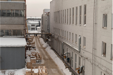 Road between buildings in winter, a Nature Photo by KAA