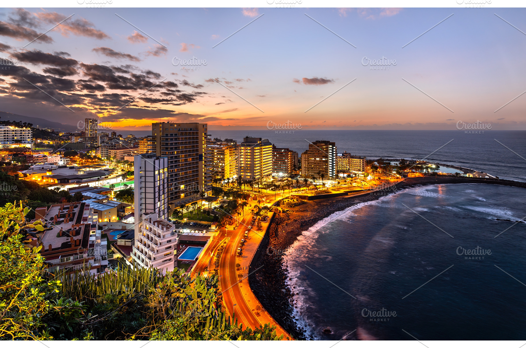 Illuminated coastal city and Lago, an Architecture Photo by Leonid Andronov