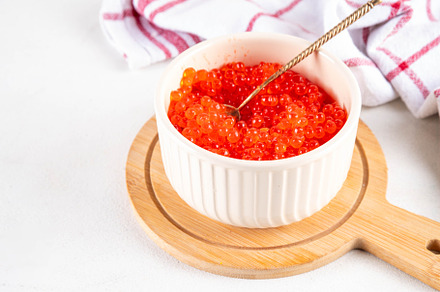Artificial red caviar in a ceramic bowl, made from seaweed algae, a Food & Drink Photo by Rimma