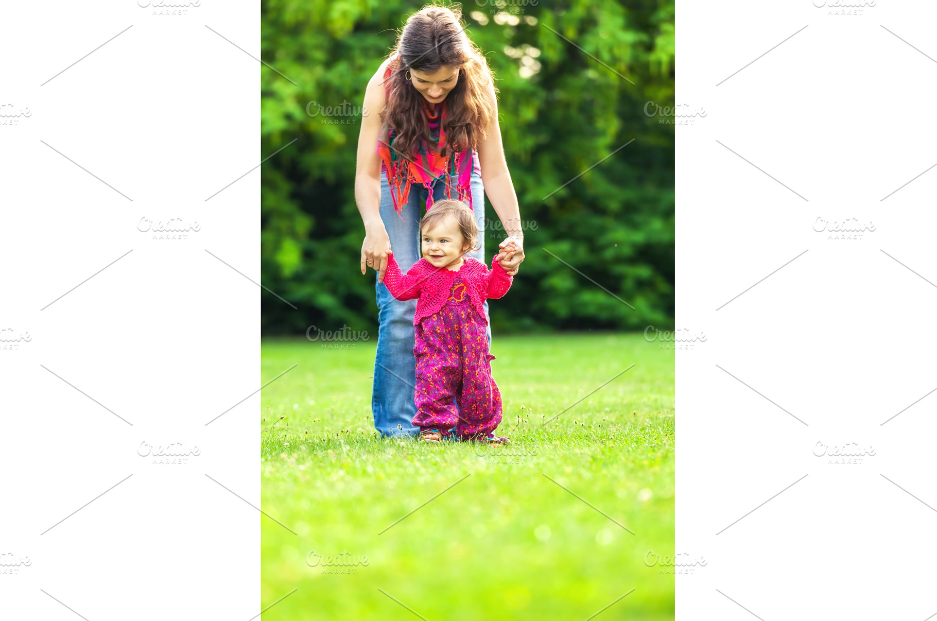 Mother with baby in the park, a Person Photo by sborisov