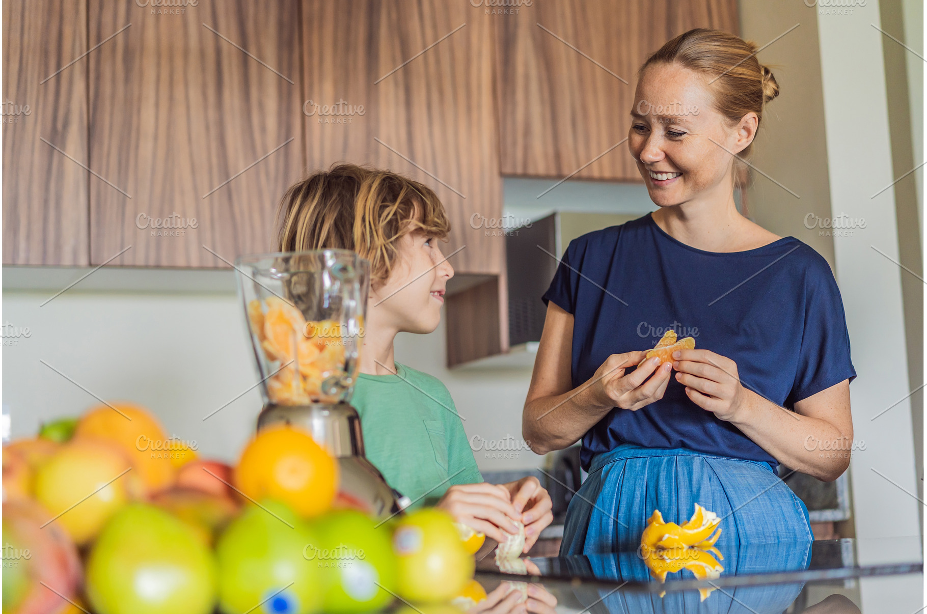 Mother and son cooking together in, a Food & Drink Photo by Elizaveta Galitskaya