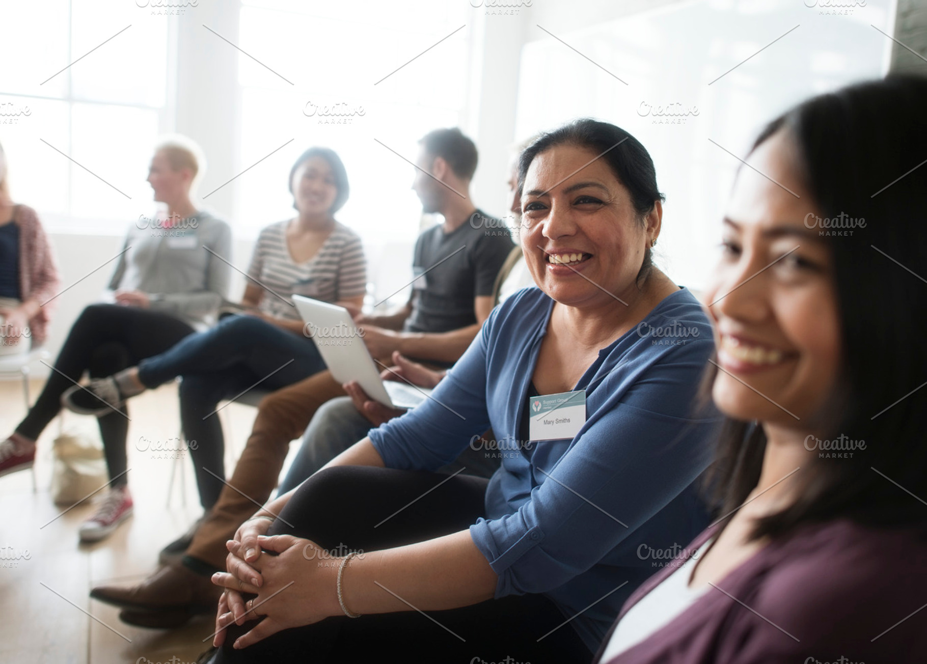 Diverse group of people in a seminar containing person, collaboration, and, a Person Photo by rawpixel