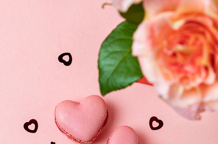 Romantic setup with coffee, macarons and roses