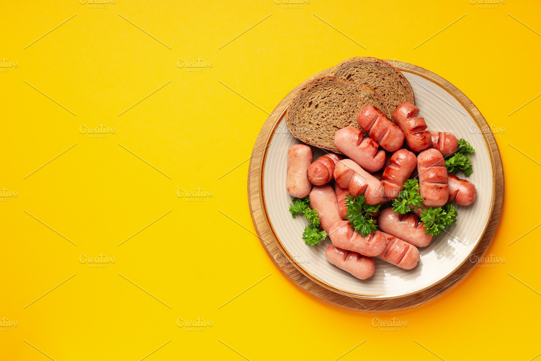 Concept of tasty food, grilled mini sausage, space for text, a Food & Drink Photo by AtlasStudio PRO