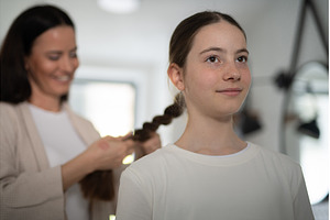 Mother braiding daughters thick hair, a Beauty & Fashion Photo by HalfPoint