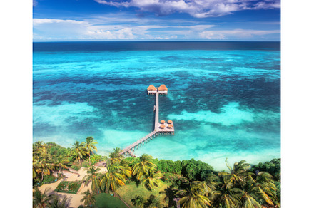 Aerial view of bungalow, white sandy, a Nature Photo by den-belitsky