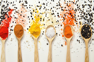 Variety of spices in wooden spoons, a Photo by Pavel_design