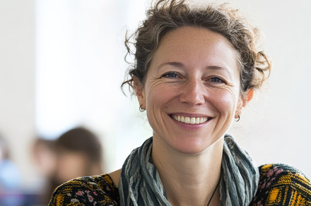 A Smiling Teacher in Classroom, a School & Education Photo by Virgo Studio