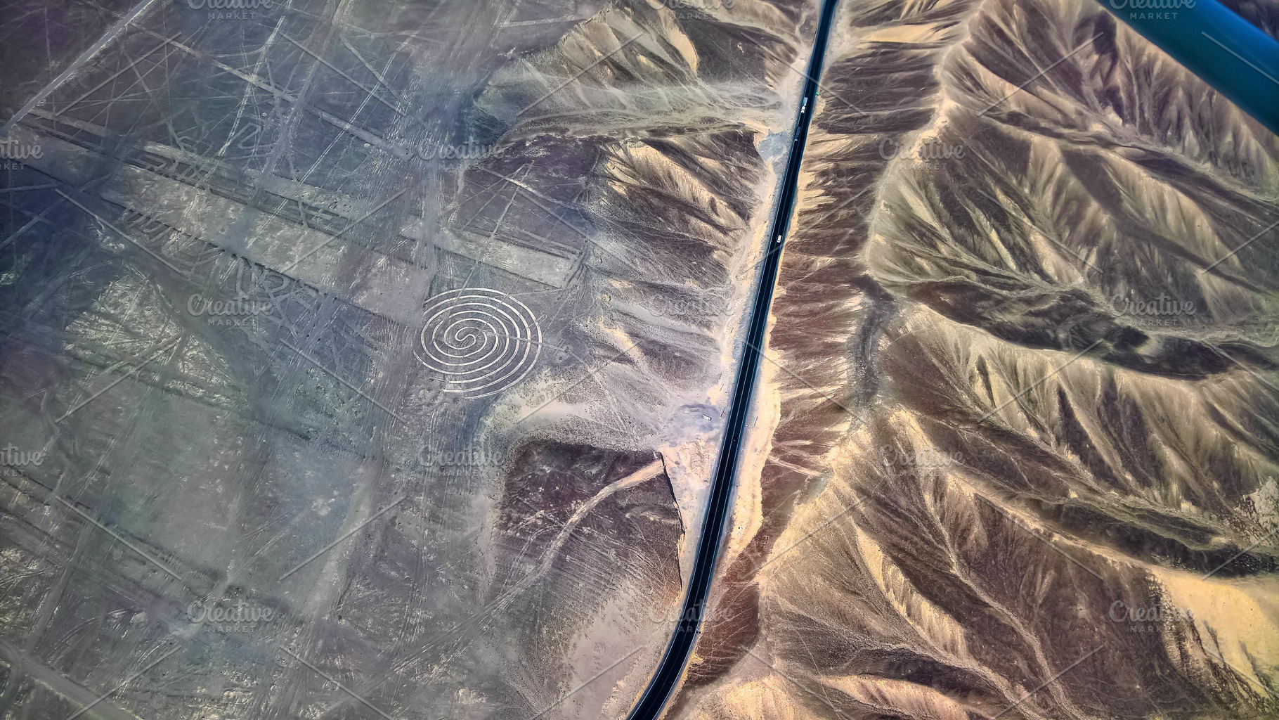 Aerial airplane panoramic view to Nazca geoglyph lines aka spiral, Ica, Peru, an Architecture Photo by Wild, Wild World