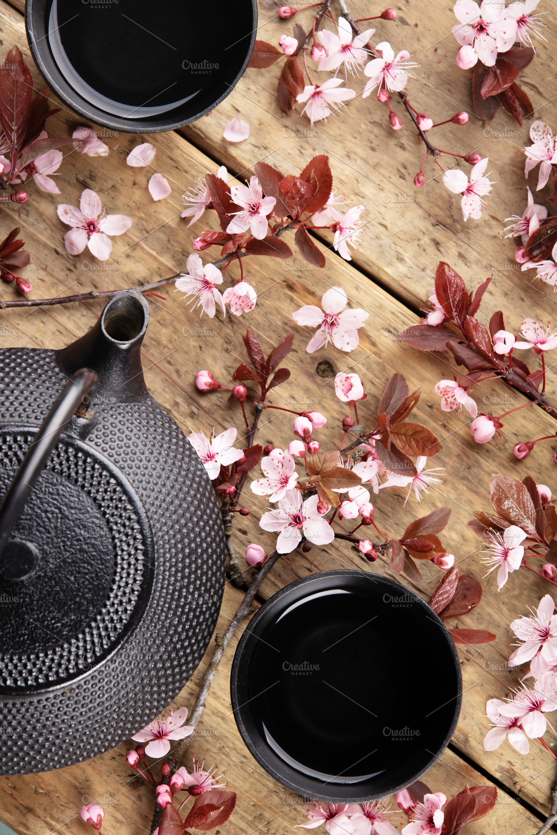 Japanese Teapot and Cups with Cherry Blossoms on Wooden Table, a Holiday Photo by Natalia Klenova's Shop
