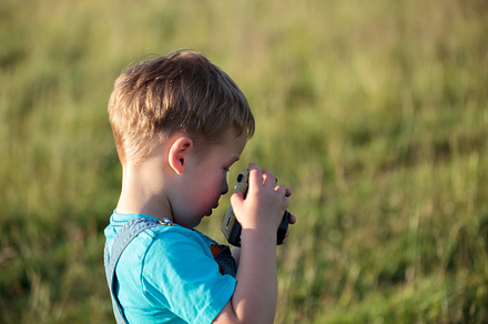 Little boy with camera outdoor stock photo containing boy and camera, an Arts & Entertainment Photo by Grey Coast Media
