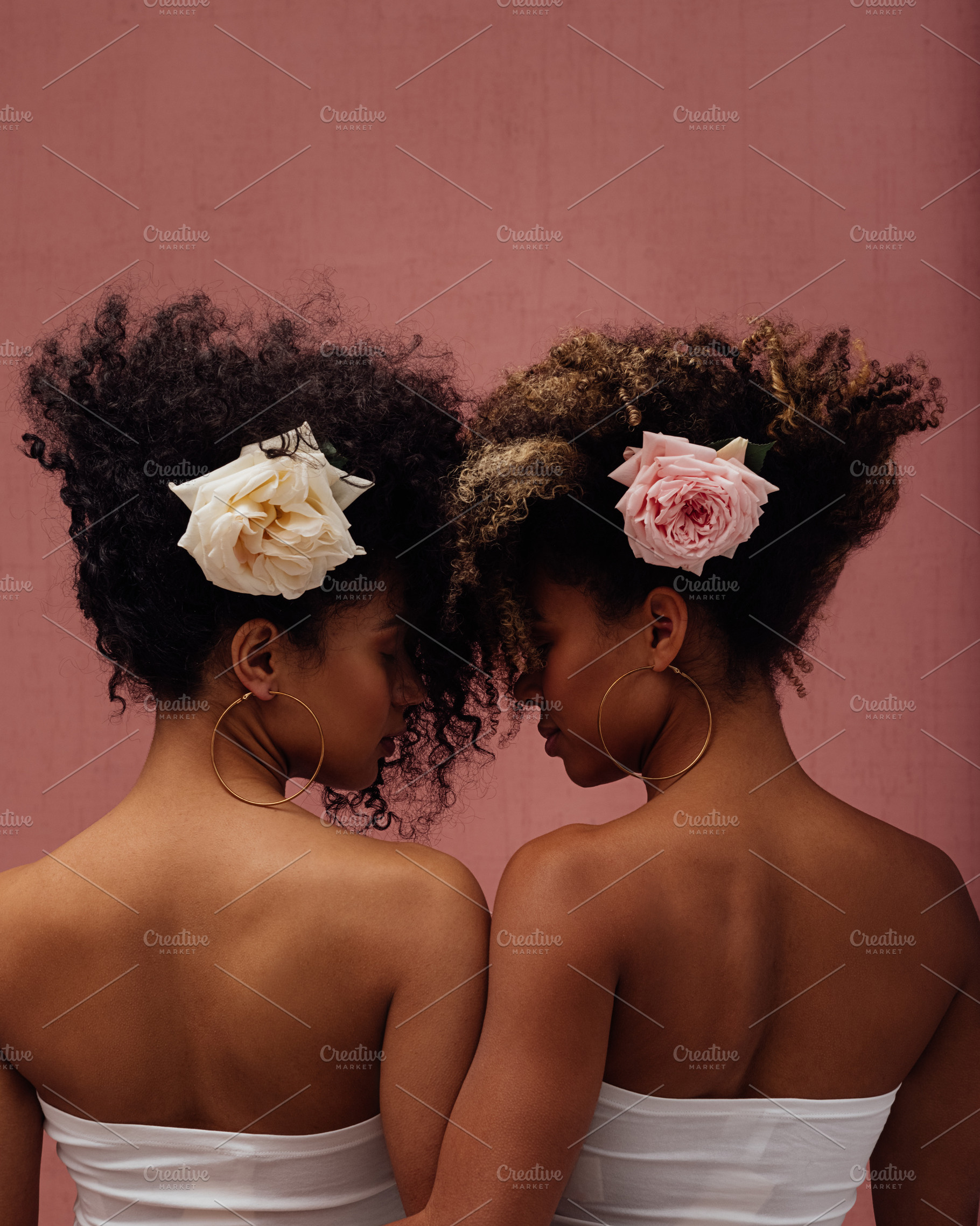 Two females with flowers, a Person Photo by Artem Varnitsin