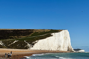 Hikers along the Seven Sisters Cliffs in East Sussex England with white chalk c, a Nature Photo by AS photostudio