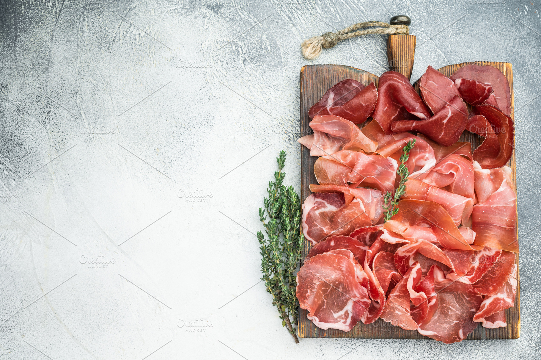 Italian charcuterie with prosciutto, coppa and bresaola arranged, a Food & Drink Photo by composter-box@mail.ru