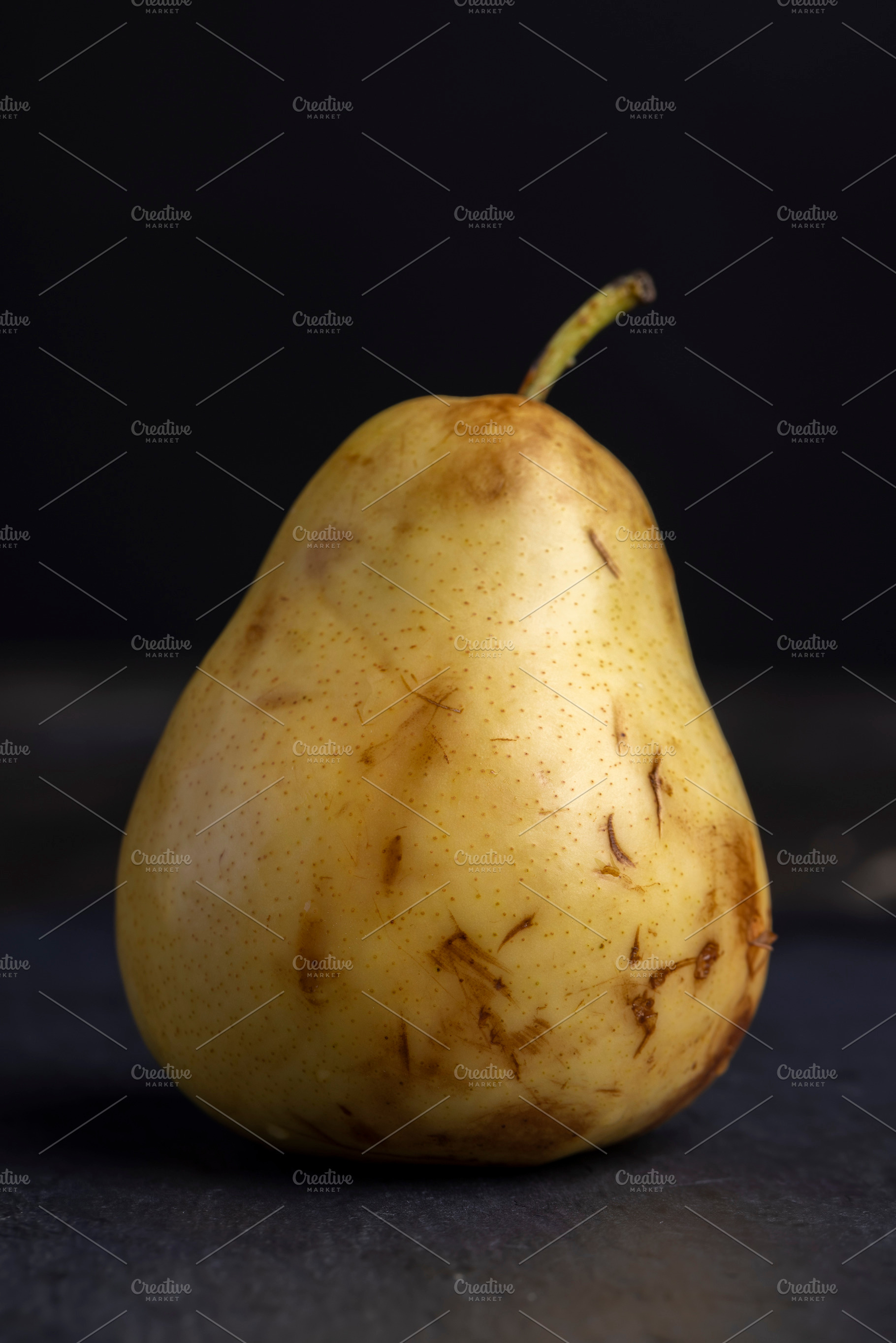 ripe green and yellow pear on a board, a Photo by MyPhotos