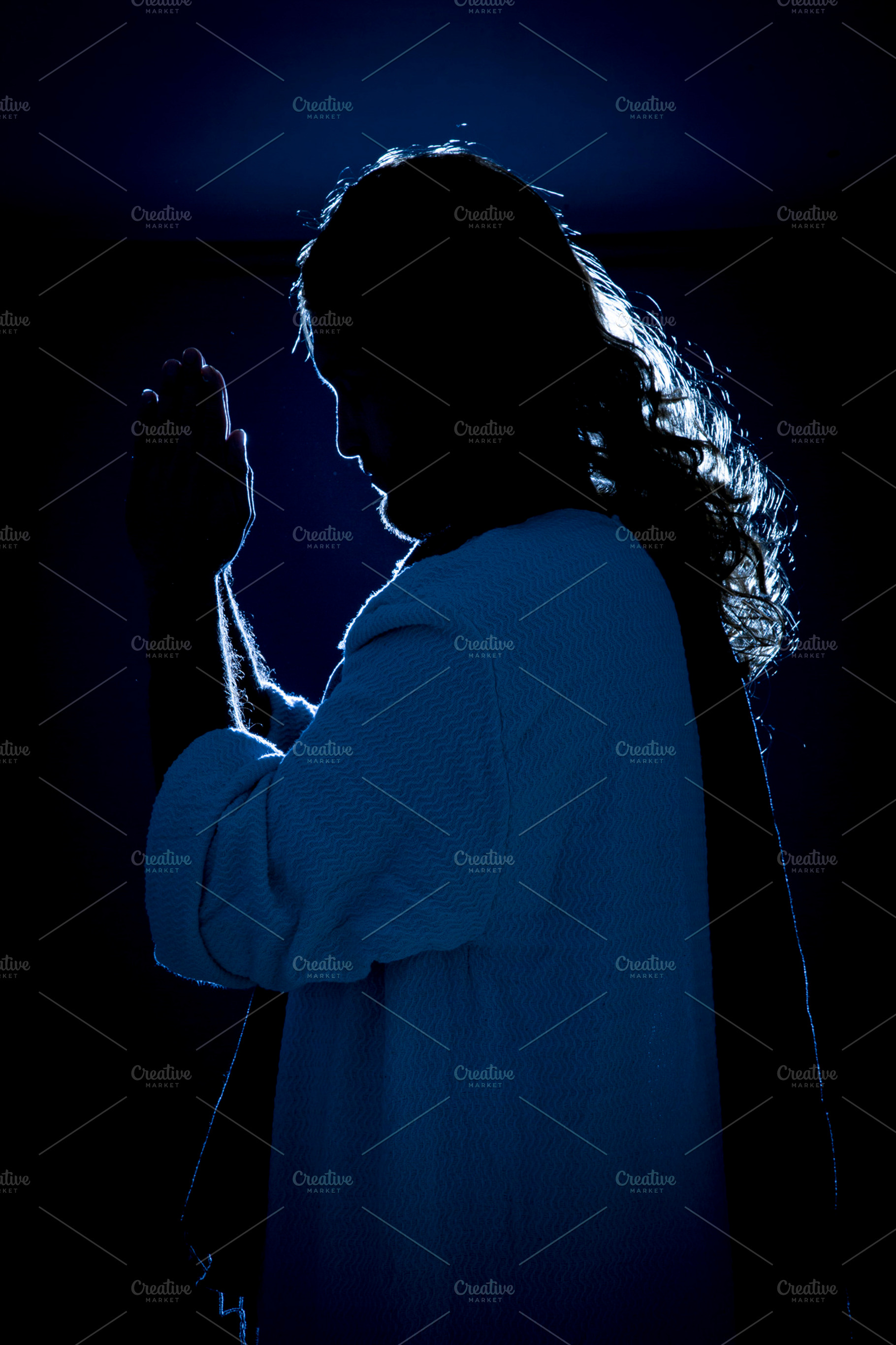 Jesus christ holding the prayer containing catholic, communion, and eternal, a Person Photo by Mexico stock images