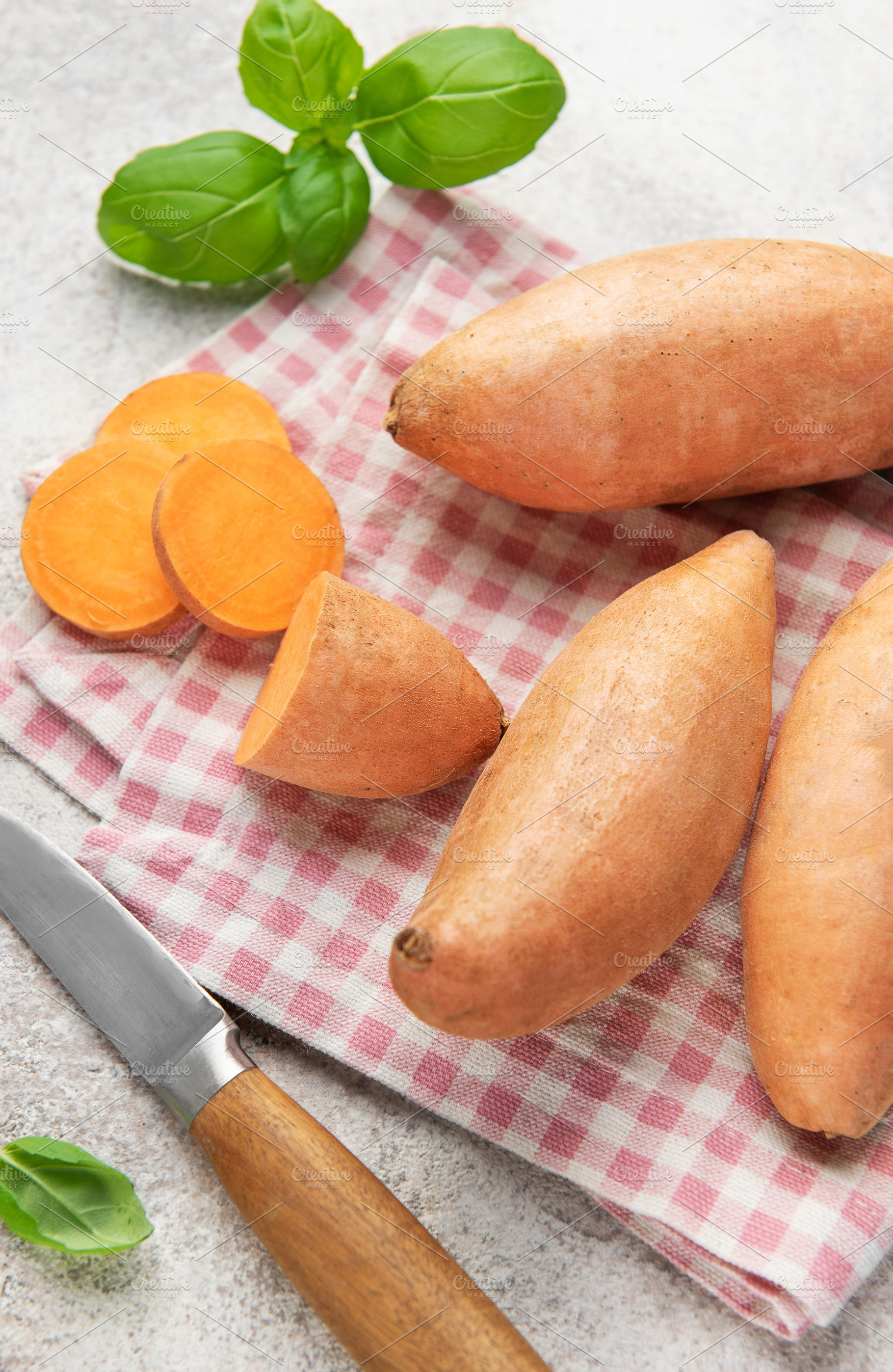 Sweet potato preparation with ingredients for healthy cooking, a Food & Drink Photo by Olena Rudo