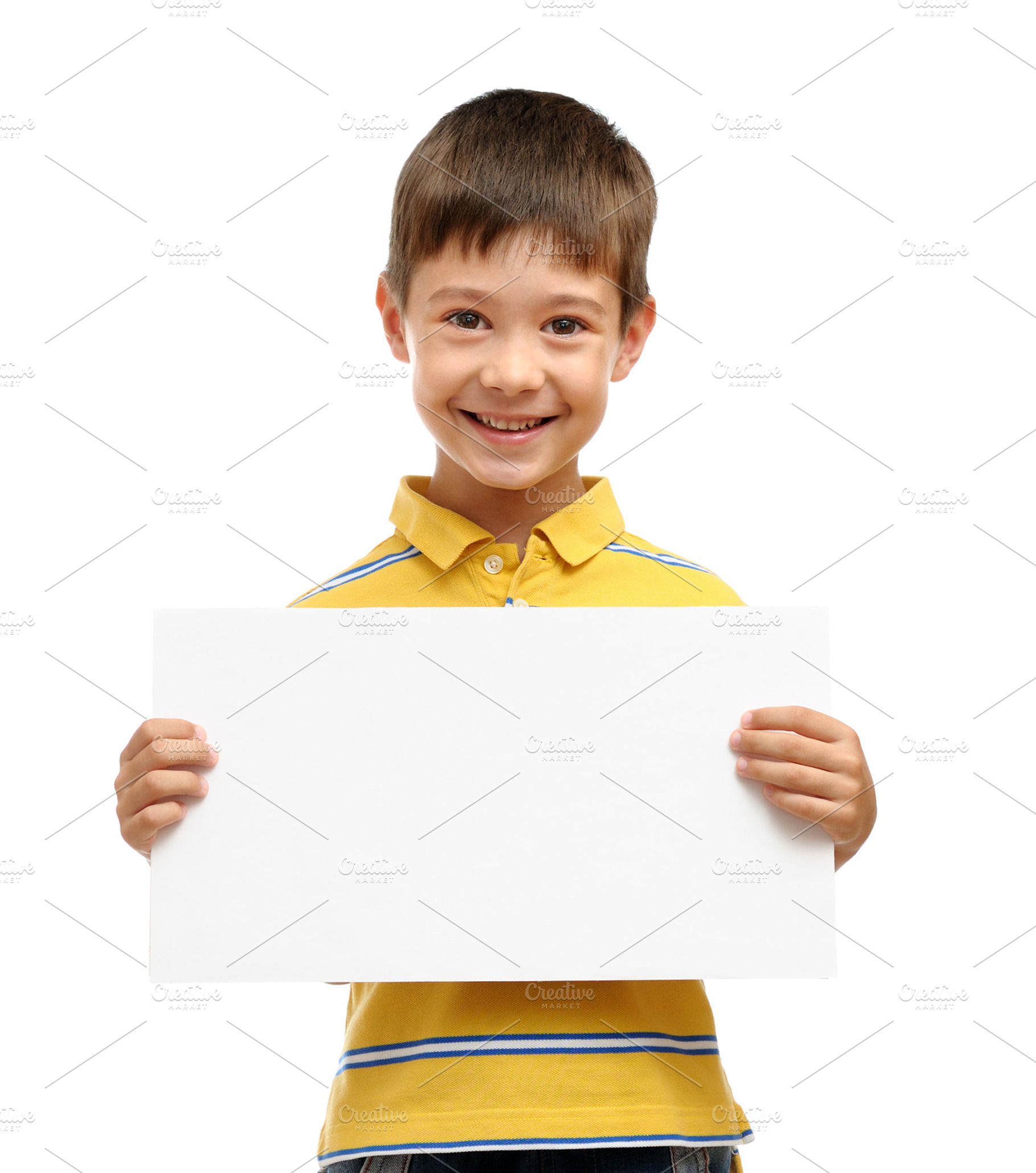 Happy boy holding blank poster
