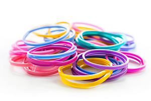 Colorful rubber hair scrunchy isolated on white background, a Beauty & Fashion Photo by AlyaAnd