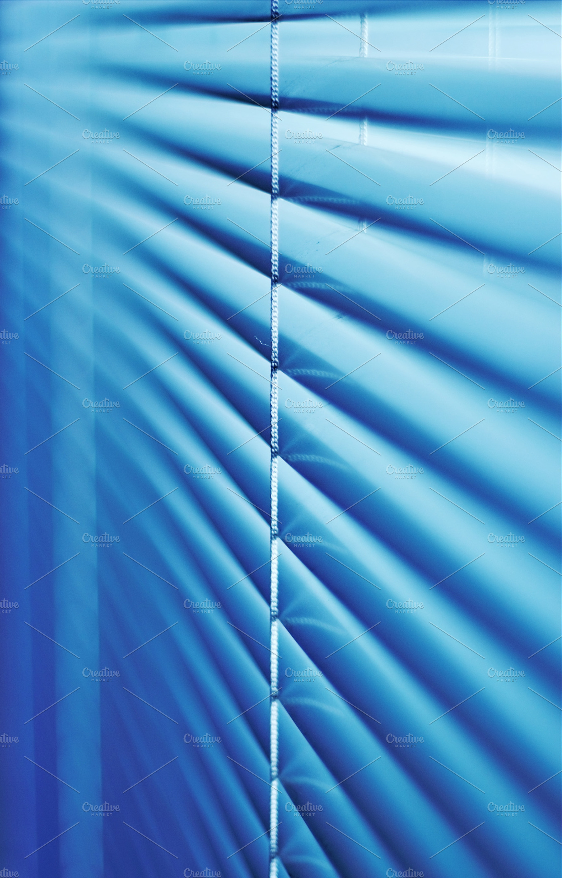 Blinds featuring inside, interior, and room