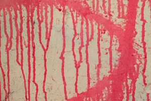 Red paint dripping down pale wall close-up, a Background Photo by DanFLCreativo