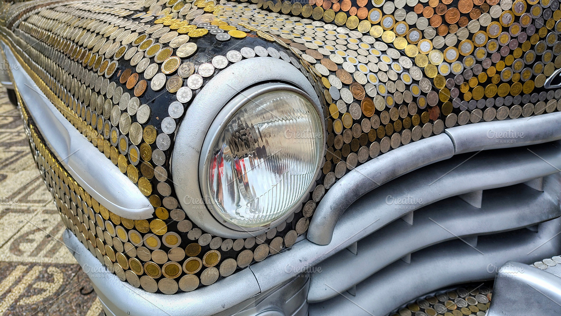 Antique car completely covered with a pattern of coins on its ex, a Transportation Photo by DanFLCreativo
